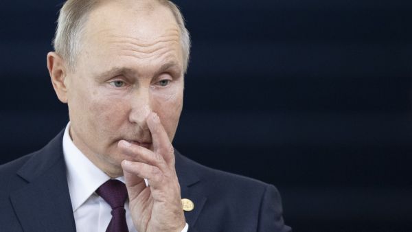 Russia's President Vladimir Putin gestures before the 11th BRICS Summit at the Itamaraty palace on November 14, 2019 in Brasilia, Brazil. Brazil's President Jair Bolsonaro walked a diplomatic tightrope, as he seeks to boost ties with Beijing and avoid upsetting key ally Donald Trump, on the eve of a summit with their BRICS counterparts from Russia, India and South Africa. Pavel Golovkin / POOL / AFP