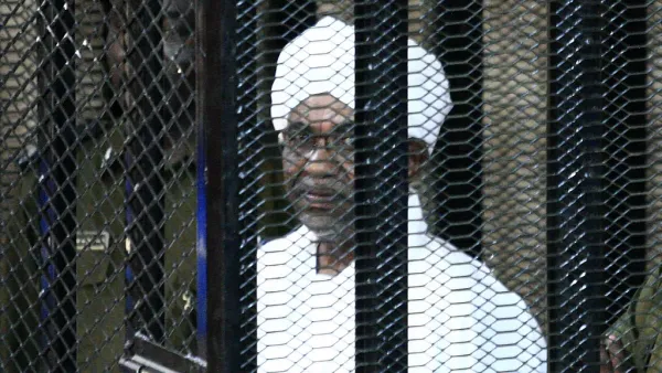 Sudan's ex-president Omar al-Bashir appears in court in the capital Khartoum on August 31, 2019 to face charges of illegal acquisition and use of foreign funds. The verdict in the corruption trial of Sudan's ousted president Omar al-Bashir is to be delivered on December 14. (AFP)