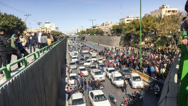 Iranian protesters block a road during a demonstration against an increase in gasoline prices in the central city of Isfahan, on November 16, 2019. One person was killed and others injured in protests across Iran. (AFP)