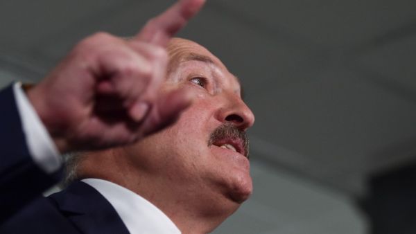 Belarus' President Alexander Lukashenko speaks with journalists as he votes at a polling station during Belarus' parliamentary election in Minsk on November 17, 2019. Sergei GAPON / AFP