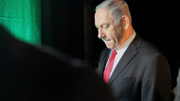 Israeli Prime Minister Benjamin Netanyahu leaves the Muni World conference in Tel Aviv. (AFP)