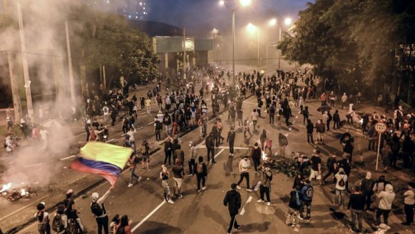 University students clash with members of the Mobile Anti-Disturbance Squadron (ESMAD), during a nationwide strike called by students, unions and indigenous groups to protest against the government of Colombia's President Ivan Duque in Medellin, Colombia, on November 21, 2019. JOAQUIN SARMIENTO / AFP