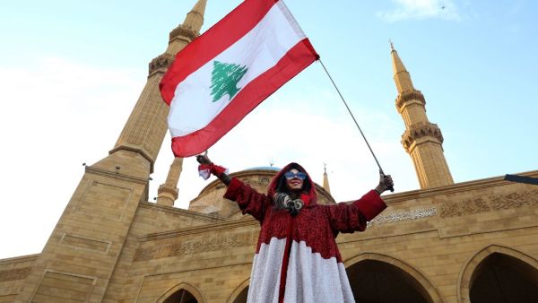 A Lebanese demonstrator is pictured in Beirut's Martyr Square during a gathering on Lebanon's Independence Day on November 22, 2019, and more than a month into protests demanding an overhaul of the entire political system. (AFP/ File Photo)