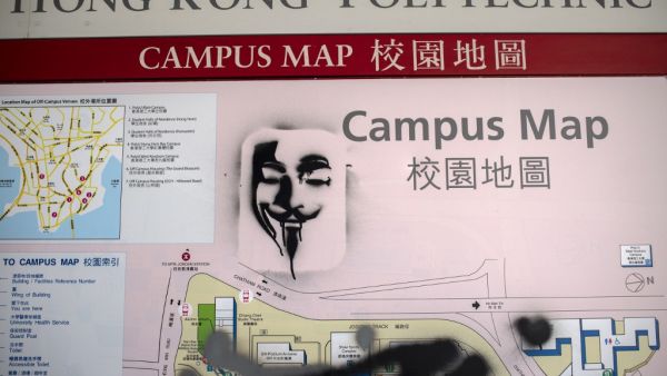 Graffiti showing a depiction of Guy Fawkes is seen on a campus map of the Hong Kong Polytechnic University where dozens of pro-democracy protesters remain holed up, in the Hung Hom district of Hong Kong on November 23, 2019. (AFP/ File Photo)