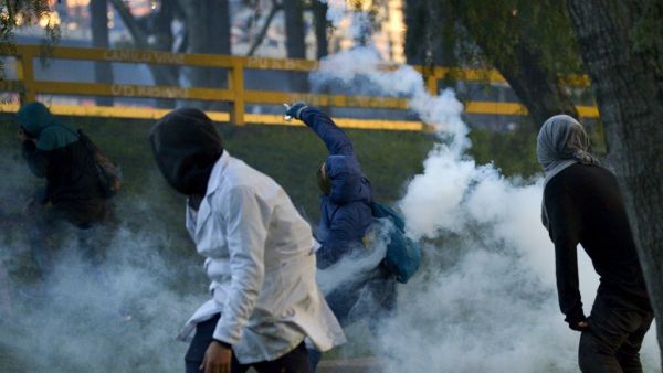 Demonstrators clash with riot police during a protest against the government of Colombian President Ivan Duque in Bogota on November 26, 2019. (AFP/ File Photo)