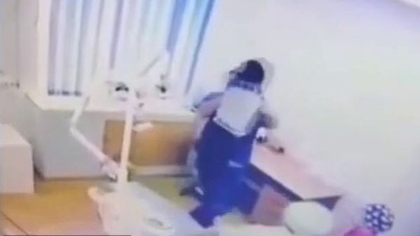 A video showing the horrific episode in Aktau, Kazakhstan, captures the moment the dentist picks the boy up, shakes him and pushes him into the chair. (Social Media/ Video Screenshot)