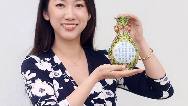 Sworders Fine Art Auctioneers' expert Yexue Li holds the little vase which was sold for £484,000 yesterday. (Sworders )