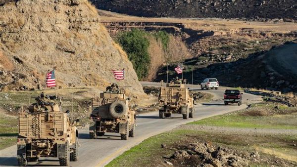 A convoy of US armored vehicles patrols the village of Ein Diwar in Syria's northeastern Hasakah province on November 4, 2019. (Photo by AFP)
