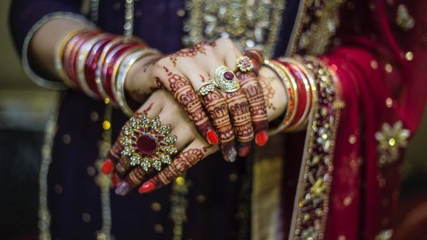 Chintaharan Chauhan who wears a red sari, huge nose ring, bangles and jhumkas everyday (Twitter)
