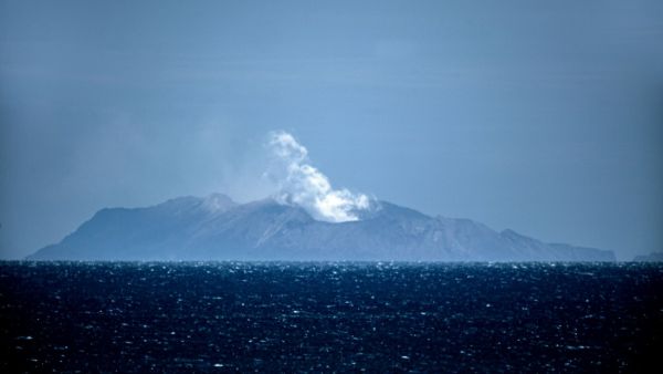 Steam rises from the White Island volcano in Whakatane on December 10, 2019, after a volcanic eruption the day before. New Zealand's Prime Minister Jacinda Ardern expressed "unfathomable grief" on December 10 after a volcanic eruption on a popular tourist island that is thought to have claimed 13 lives. Marty MELVILLE / AFP