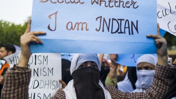 Protesters display placards during a demonstration against the Indian government's Citizenship Amendment Bill in New Delhi on December 14, 2019. (AFP/ File Photo)
