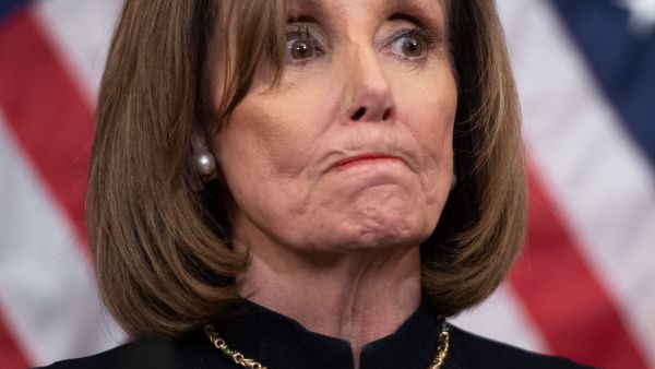 US Speaker of the House Nancy Pelosi holds a press conference after the House passed Resolution 755, Articles of Impeachment Against President Donald J. Trump, at the US Capitol in Washington, DC, on December 18, 2019. The US House of Representatives voted 229-198 on Wednesday to impeach President Donald Trump for obstruction of Congress. The House impeached Trump for abuse of power by a 230-197 vote. The 45th US president is just the third occupant of the White House in US history to be impeached. SAUL LOE