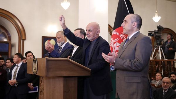 Afghan presidential candidate Ashraf Ghani (C) gives a speech during a press conference after the announcement of the preliminary elections results in Kabul on December 22, 2019. Afghanistan's President Ashraf Ghani appeared to have secured a second term on December 22, narrowly scoring an outright win in preliminary polling results, but his main rival immediately vowed to challenge the tally. STR / AFP