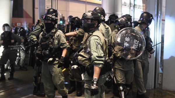 Riot police leave the Langham Place shopping mall after entering to search for protesters, in Mong Kok in Hong Kong on December 26, 2019. Hong Kong endured a third straight day of political unrest over the Christmas period on December 26 as police and pro-democracy protesters clashed inside shopping malls. Protesters spent the afternoon marching through multiple malls chanting anti-government and anti-police slogans. Philip FONG / AFP