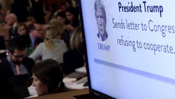 A graphic indicating U.S. President Donald Trump's refusal to cooperate with congressional investigators is shown on a monitor as constitutional scholars Noah Feldman of Harvard University, Pamela Karlan of Stanford University, Michael Gerhardt of the University of North Carolina, and Jonathan Turley of George Washington University testify before the House Judiciary Committee in the Longworth House Office Building on Capitol Hill December 4, 2019 in Washington, DC.  (AFP/ File Photo)