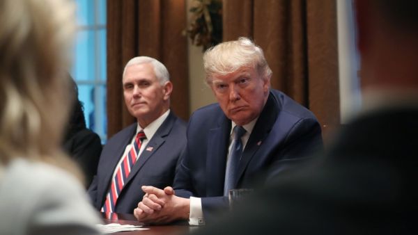  U.S. Vice President Mike Pence (L) and President Donald Trump listen during a round table on empowering families with education choice, in the Cabinet Room on December 9, 2019 in Washington, DC. (AFP/ File Photo)