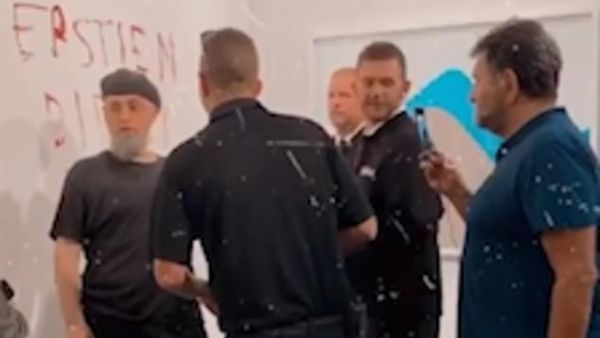 The message was written in red lipstick on the wall after the banana was removed due to crowd safety (dailymail)