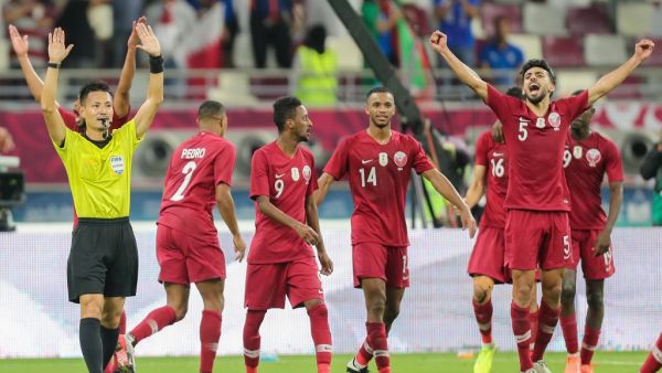 Qatar players cheer as Japanese referee Ryuji Sato signals the end of the 24th Arabian Gulf Cup Group A football match between Qatar and the United Arab Emirates at the Khalifa International Stadium in the Qatari capital Doha on December 2, 2019. KARIM JAAFAR / AFP