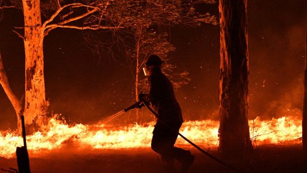 Fire-ravaged Australia has launched a major operation to reach thousands of people stranded in seaside towns after deadly bushfires ripped through popular tourist areas on New Year's Eve. SAEED KHAN / AFP