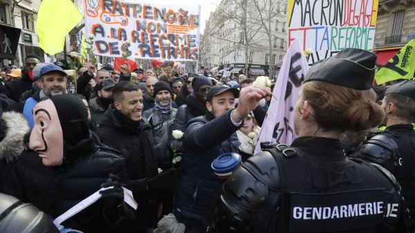 People hold banners reading " RATP on strike, no to pension reforms " during a protest called by French national trade union General Confederation of Labour (CGT), on January 4, 2020, in Paris. FRANCOIS GUILLOT / AFP