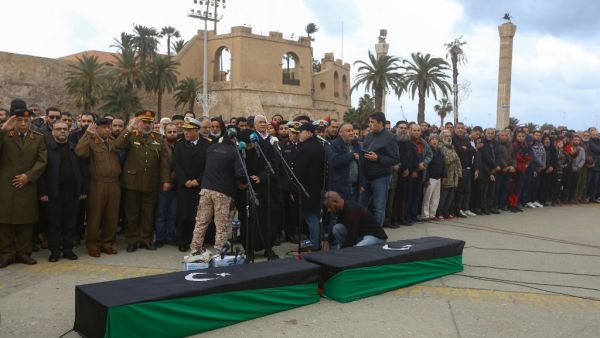 Libyan mourners pray by the coffins of army cadets, who were killed in an air strike on a military school, during their funeral in the Libyan capital Tripoli on January 5, 2020. (AFP/ File Photo)