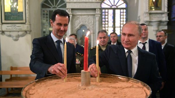 Russian President Vladimir Putin and Syrian President Bashar al-Assad visit the Mariamite Cathedral of Damascus, one of the oldest Greek Orthodox churches in the Syrian capital, in Damascus on January 7, 2020. Putin met his Syrian counterpart Bashar al-Assad during an unprecedented visit to Damascus as the prospect of war between Iran and the United States loomed over the region. Alexey DRUZHININ / SPUTNIK / AFP