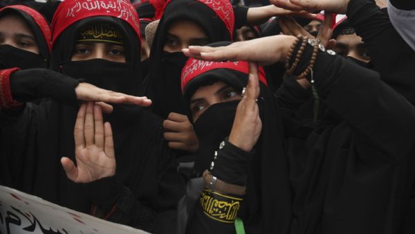 Shiite Muslims take part in a anti-US protest against the killing of top Iranian commander Qasem Soleimani in Iraq, in Lahore on January 12, 2020. Iran's Revolutionary Guards chief briefed parliament on January 12 over the killing of a top general by the US, Tehran's retaliation and the subsequent downing of an airliner, ISNA news agency said. ARIF ALI / AFP