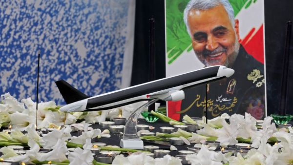 A poster of slain military commander Qasem Soleimani is seen at a memorial for the victims of the Ukrainian plane crash, in University of Tehran on January 14, 2020. Iran announced its first arrests over the shooting down of a Ukrainian airliner last week, as it struggles to contain the fallout from the disaster that sparked three days of protests. ATTA KENARE / AFP