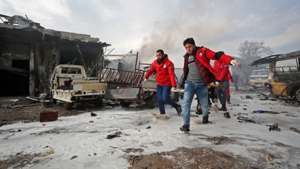 Syrian paramedics carry away on a stretcher a wounded man following a regime air strike on a vegetable market in Syria's last major opposition bastion of Idlib on January 15, 2020. (AFP/ File Photo)
