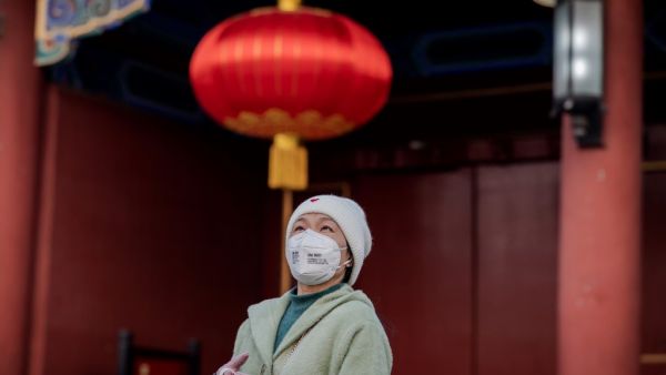 This picture taken on January 25, 2020 shows a woman wearing a protective facemask to help stop the spread of a deadly SARS-like virus which originated in the central city of Wuhan at Jingshawn Park in Beijing. (AFP/ File Photo)