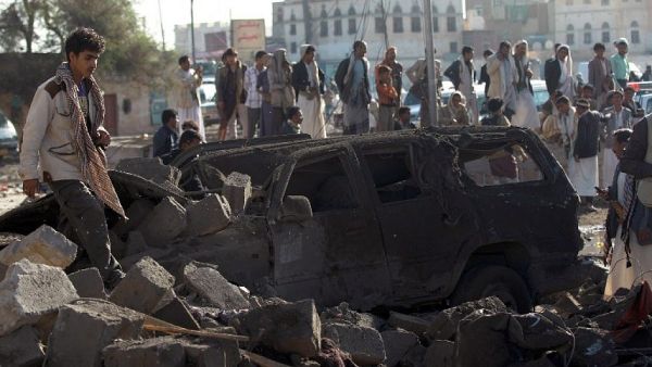 Yemenis stand at the site of a Saudi airstrike against Houthi rebels near Sanaa Airport on March 26, 2015, which killed at least 13 people. (photo credit: AFP/Mohammed Huwais) Yemenis stand at the site of a Saudi airstrike against Houthi rebels near Sanaa Airport on March 26, 2015, which killed at least 13 people. (photo credit: AFP/Mohammed Huwais)