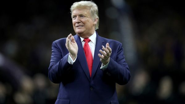 U.S. President Donald Trump claps prior to the College Football Playoff National Championship game between the Clemson Tigers and the LSU Tigers at Mercedes Benz Superdome on January 13, 2020 in New Orleans, Louisiana. Chris Graythen/Getty Images/AFP