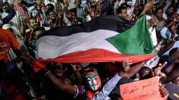 Sudanese protesters gather for a sit-in outside the Defence Ministry compound in Khartoum [File: Mohamed el-Shahed/AFP] 