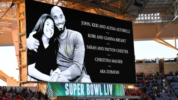 A tribute to Kobe Bryant and the victims of the helicopter crash is seen on a screen ahead of Super Bowl LIV between the Kansas City Chiefs and the San Francisco 49ers at Hard Rock Stadium in Miami Gardens, Florida, on February 2, 2020. Angela Weiss / AFP
