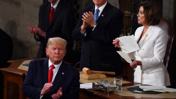 Speaker of the US House of Representatives Nancy Pelosi rips a copy of US President Donald Trumps speech after he delivered the State of the Union address at the US Capitol in Washington, DC, on February 4, 2020. Olivier DOULIERY / AFP
