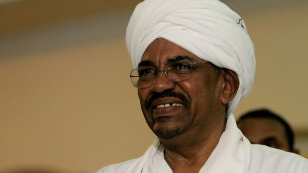 Sudanese President Omar al-Bashir looks on during a meeting in Khartoum with an Egyptian diplomatic delegation. Sudan has agreed to hand over ousted autocrat Omar al-Bashir and others to the International Criminal Court for alleged war crimes in Darfur, a top official of the new ruling body said on February 11, 2020. Ashraf SHAZLY / AFP