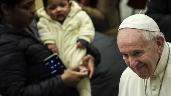 Pope Francis (R) meets with attendees during the weekly general audience on February 12, 2020 at Paul-VI hall in the Vatican. Filippo MONTEFORTE / AFP