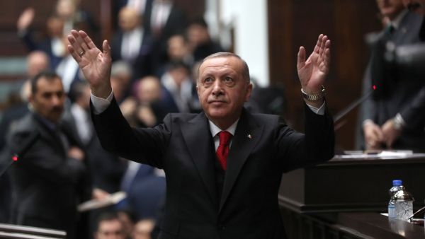 President of Turkey and leader of Justice and Development (AK) Party Recep Tayyip Erdogan waves as he attends the party's group meeting at Grand National Assembly of Turkey in Ankara, on February 12, 2020. Adem ALTAN / AFP