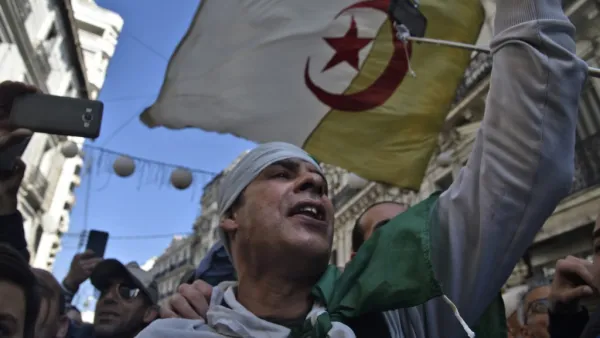 Algerians chant slogans as they march in an anti-government demonstration in the capital Algiers on February 14, 2020. RYAD KRAMDI / AFP
