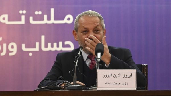 Afghanistan's Health Minister Ferozuddin Feroz gestures as he speaks during a press conference in Kabul on February 24, 2020. Afghanistan has detected its first novel coronavirus case, the country's health minister said on February 24, involving a patient who had recently travelled to Iran, where 12 people have died from the outbreak. WAKIL KOHSAR / AFP