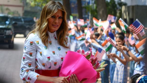 US First Lady Melania Trump holds flowers as she arrives at Sarvodaya Co-Ed Senior Secondary School, in New Delhi on February 25, 2020. US President Donald Trump moves from sightseeing and speech-making to tough trade talks in India on February 25, as First Lady Melania visits a Delhi school to witness a "happiness class". Sajjad HUSSAIN / AFP