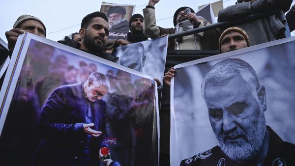 Protesters in Indian Kashmir shout slogans against the United States and Israel as they hold posters with the image of top Iranian commander Qasem Soleimani, who was killed in a U.S. airstrike in Iraq, Jan. 3, 2020. (Tauseef Mustafa/AFP via Getty Images)