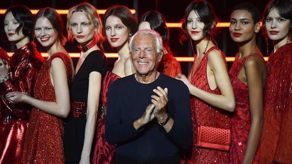 Giorgio Armani (pictured in Milan yesterday) has been criticised for saying women are being 'raped' by designers who push them to wear provocative clothing (AFP)