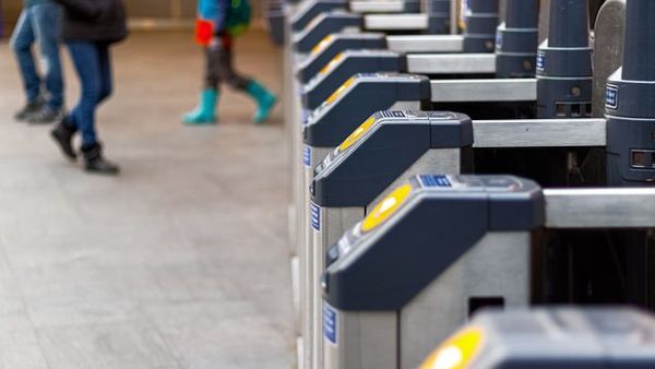 Technology being developed by payment giant Mastercard would allow travellers to pay simply by walking up to a turnstile (stock image/ Shutterstock)