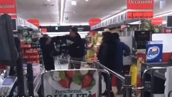 Scuffle: A fight broke out (pictured above) in an Italian supermarket, said to be inside the 'red zone' in northern Italy where 50,000 people have been placed in quarantine. (Facebook)