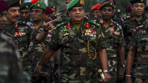 In this Jan 14, 2020, Sri Lanka's Army chief Shavendra Silva (center) arrives to supervise the military operation to revive abandoned rice paddies. (AFP)