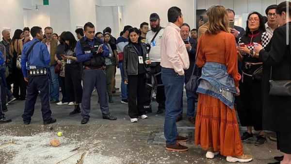 The aftermath at the Mexico City gallery on Sunday - the glass is shattered across the floor and the everyday objects scattered on the floor (Twitter)