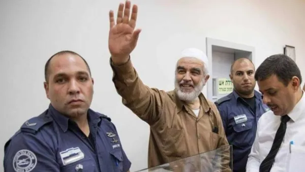 Arab Israeli cleric Sheikh Raed Salah, seen waving in this August 2017 picture. (AFP)
