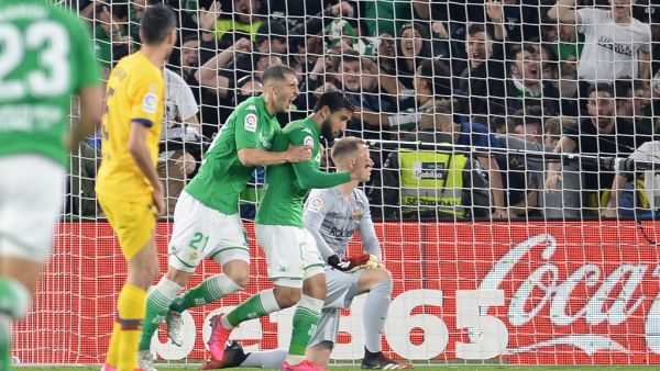 Real Betis' French midfielder Nabil Fekir (2R) celebrates his goal against FC Barcelona at the Benito Villamarin stadium in Seville on Feb 9, 2020. CRISTINA QUICLER / AFP