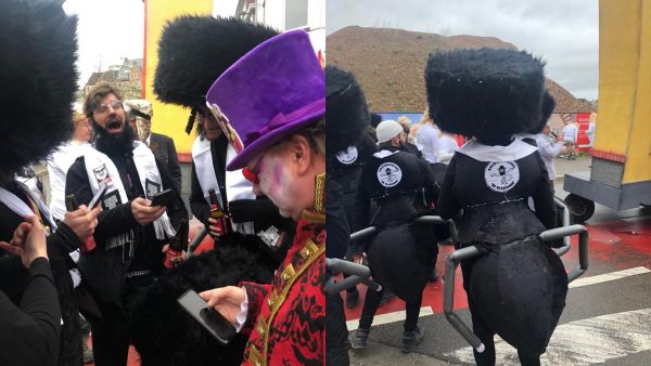 Participants of the Aalst Carnival wearing costumes combining ultra-Orthodox Jewish attire with ant limbs at the event in Aalst, Belgium on February 23, 2020. (Cnaan Liphshiz/ Twitter/ @RaphaelAhren)